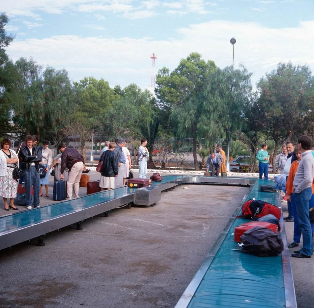 Tourists waiting for their luggage at AlmerÕa Airport at the Costa de AlmerÕa, Andalusia, Spain 1980s.