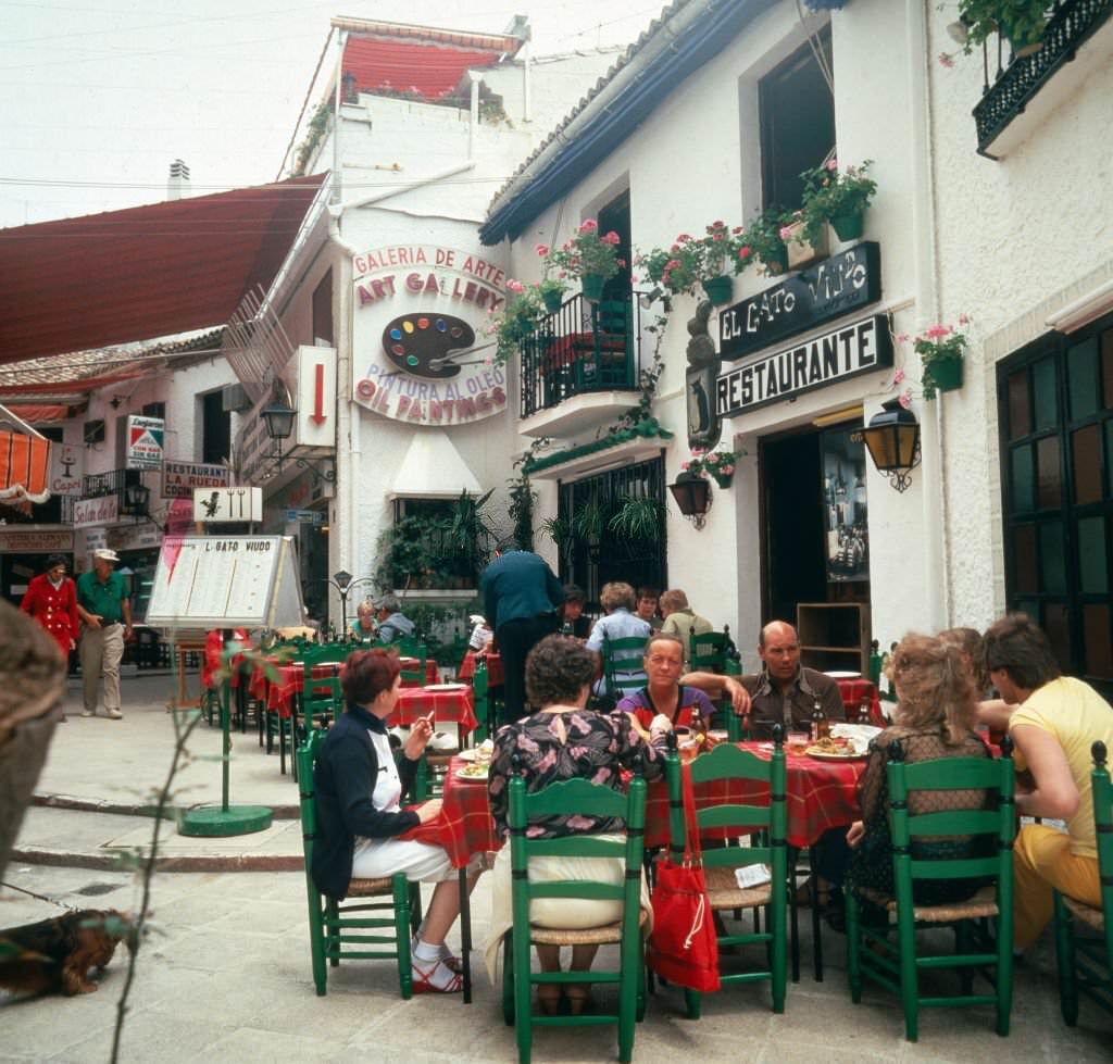 Being guest in a street cafe of Torremolinos, Andalusia, Spain 1980s.