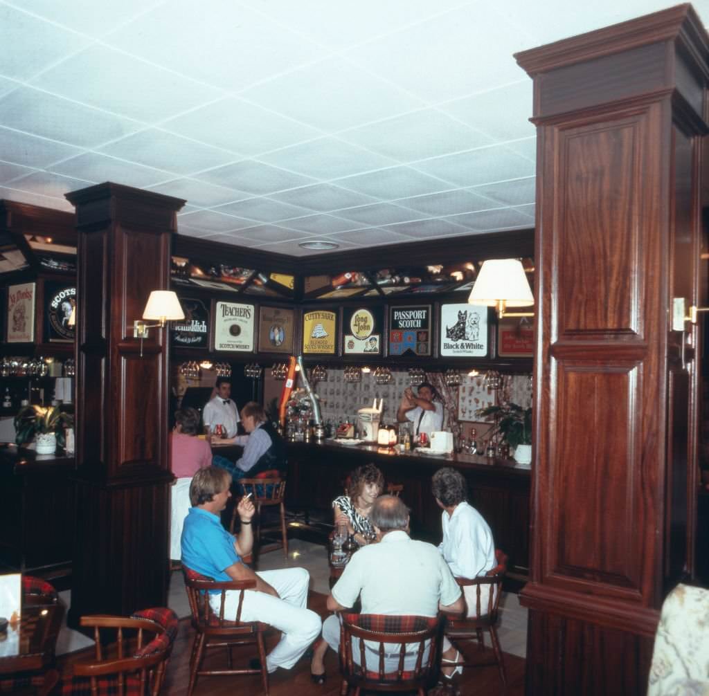 At the bar of Hotel Playalinda in Roquetas de Mar, Andalusia, Spain 1980s.