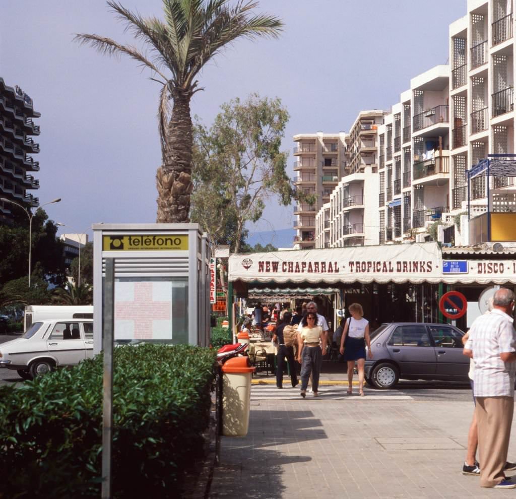 On the road in the tourist centre of Roquetas de Mar, Andalusia, Spain 1980s.