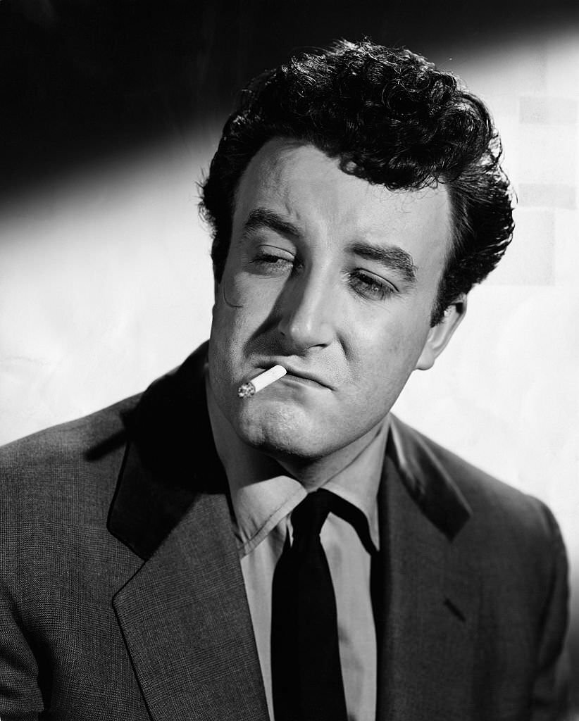 Peter Sellers as he appears in the role of "Mr. Robinson," alias Harry, a member of the "Guinness Gang