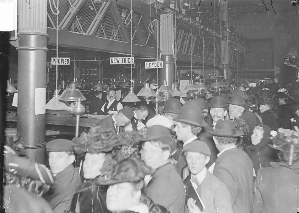 Crowds lined up to pay taxes at the County Treasurer's office in the City Hall and County Building in the Loop community area, Chicago, Illinois, April 27, 1903.