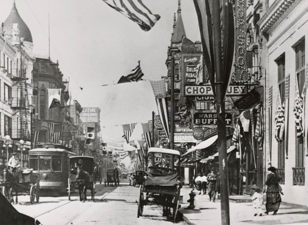 Horse-drawn carriages and a streetcar in the 'Little Poland' section of Milwaukee Avenue and Division Street in Chicago, Illinois, 1905