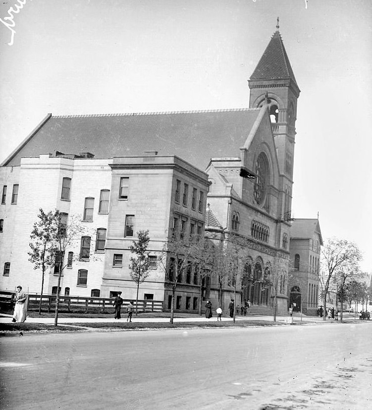 Exterior view of Holy Angels Roman Catholic Church at 607 East Oakwood Boulevard in the Grand Boulevard community area, Chicago, Illinois, 1900s.