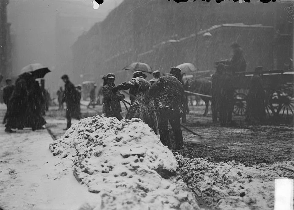 A street covered in snow during a blizzard, Chicago, Illinois, 1900s.