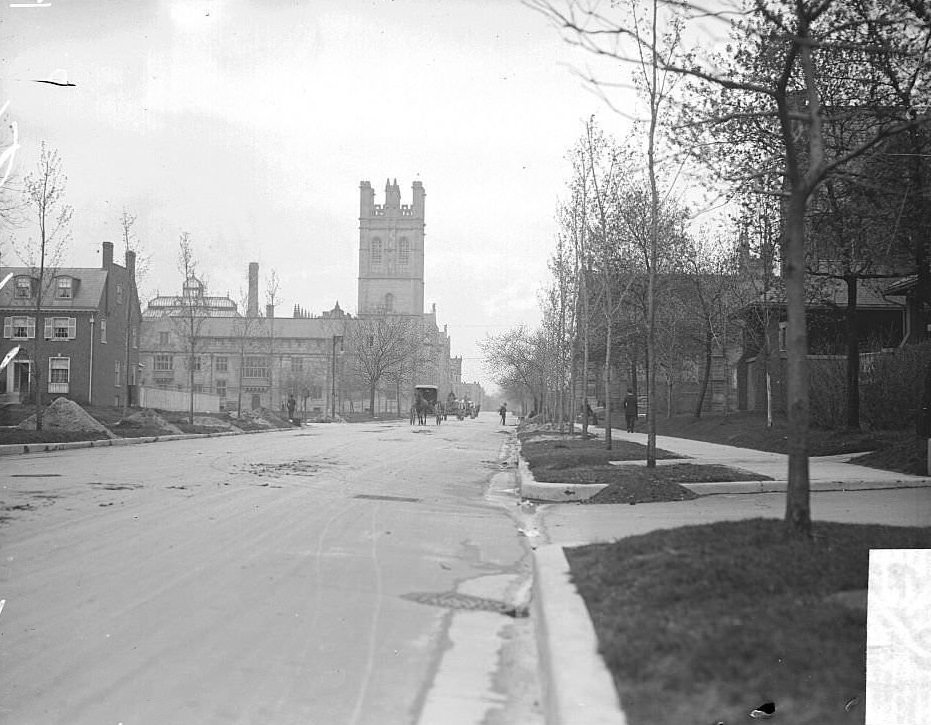 View looking west along East 57th Street from South Kimbark Avenue toward the John J Mitchell tower at the University of Chicago in the Hyde Park community area of Chicago, Illinois, 1900s.