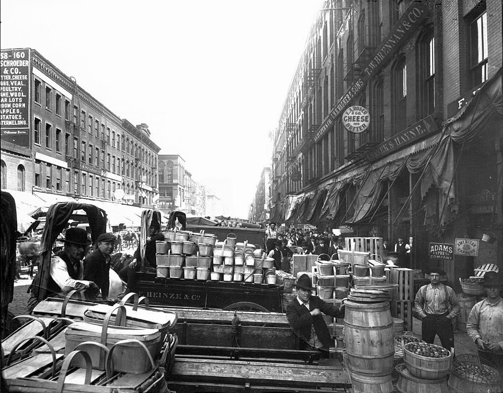 View of merchants with carts of goods at South Water Street Market, Chicago, Illinois, 1905