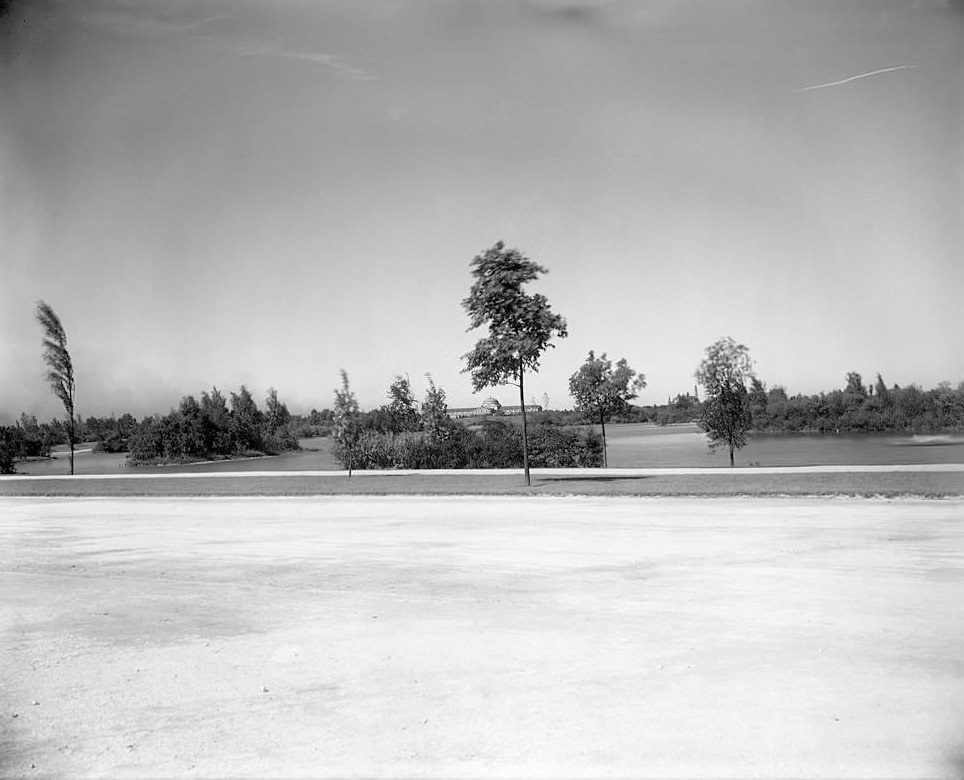 View of Jackson Park road, trees and lagoon,Field Columbian Museum and German building in the far distance, Chicago, Illinois, 1905.