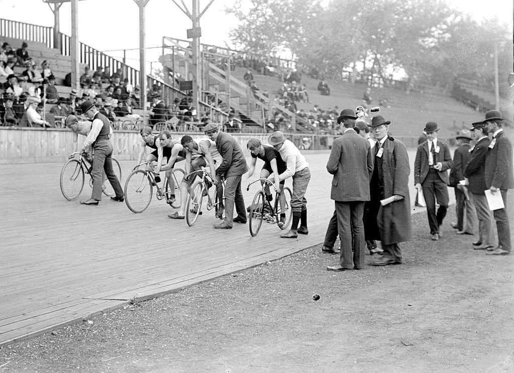 Cyclists, including one African American, positioning on a wooden track to begin a race at a velodrome in Chicago, Illinois, 1901.