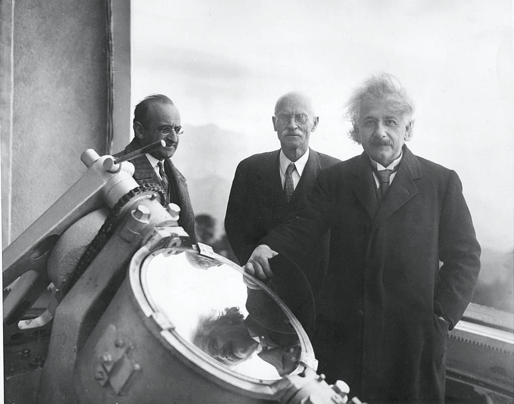 Albert Einstein with American astronomer Charles E. St. John (center), and an unidentified man at the Mount Wilson Observatory in the Sierra Madre mountains, California, January 29, 1931.