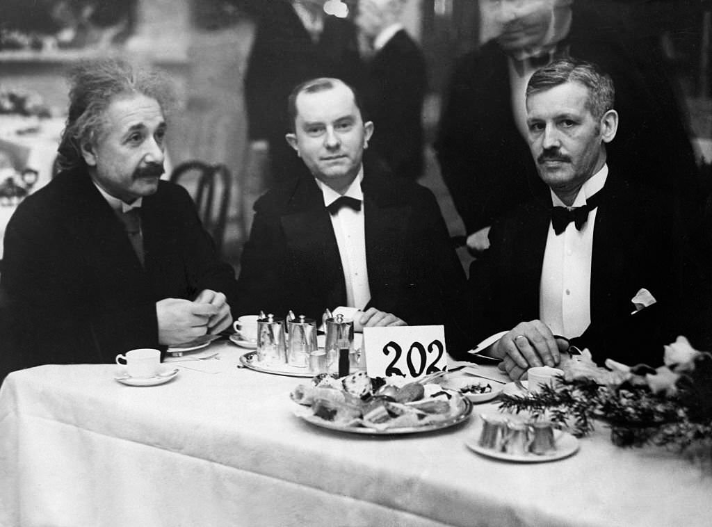 Albert Einstein with member of the German Reichstag (Parliament), spokesman on foreign affairs for the German Social Democratic Party with and former German minister of finance Dr. Peter Reinhold (center) at Kroll in Berlin