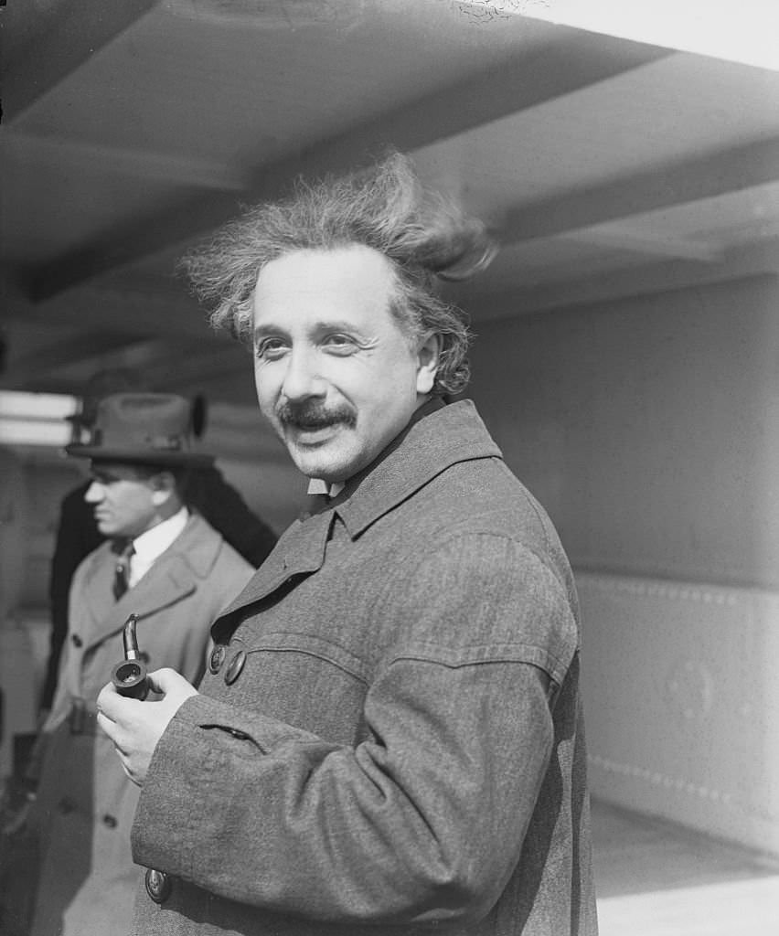 Albert Einstein Holding a Pipe