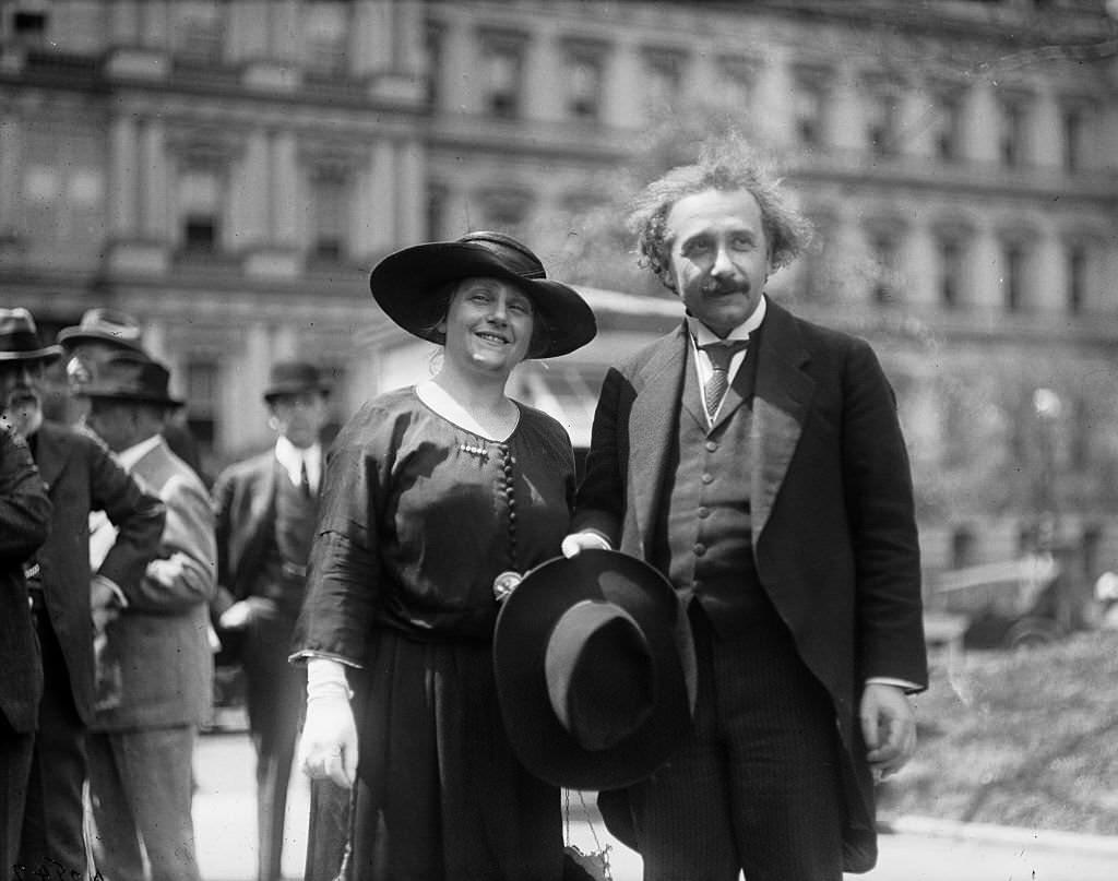 Albert Einstein with his wife Elsa, State, War, and Navy building in background, Washington DC., 1921
