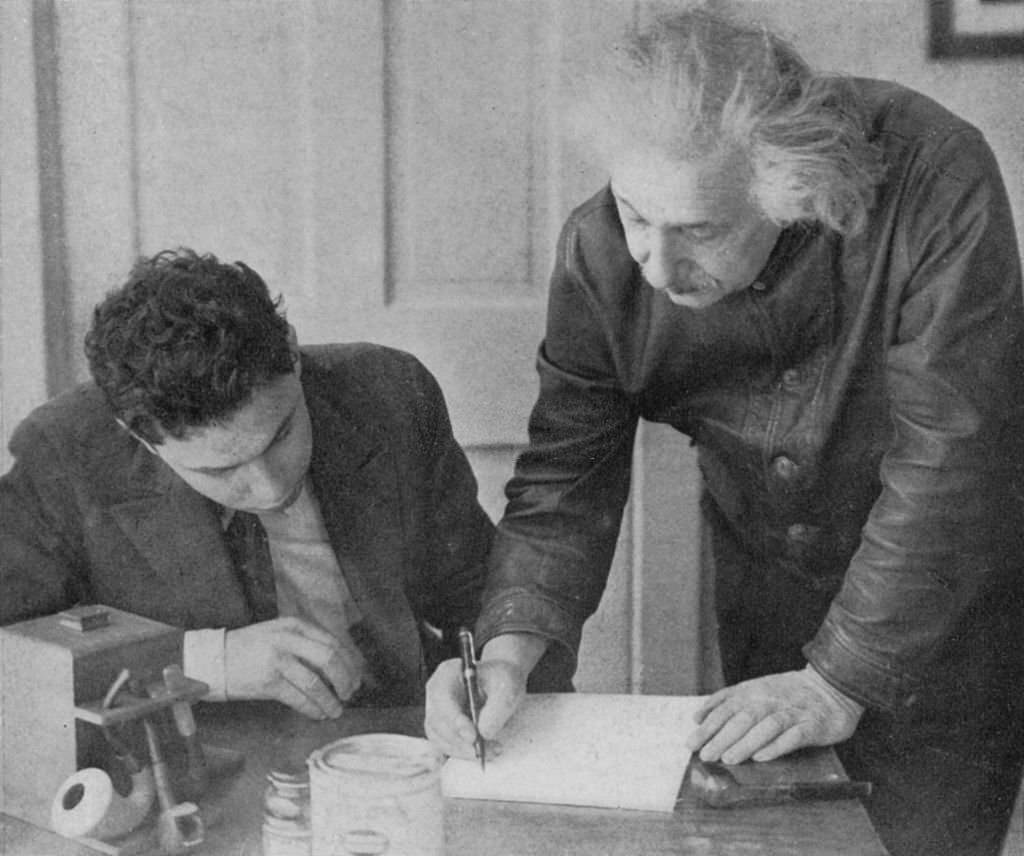 Albert Einstein with a student.