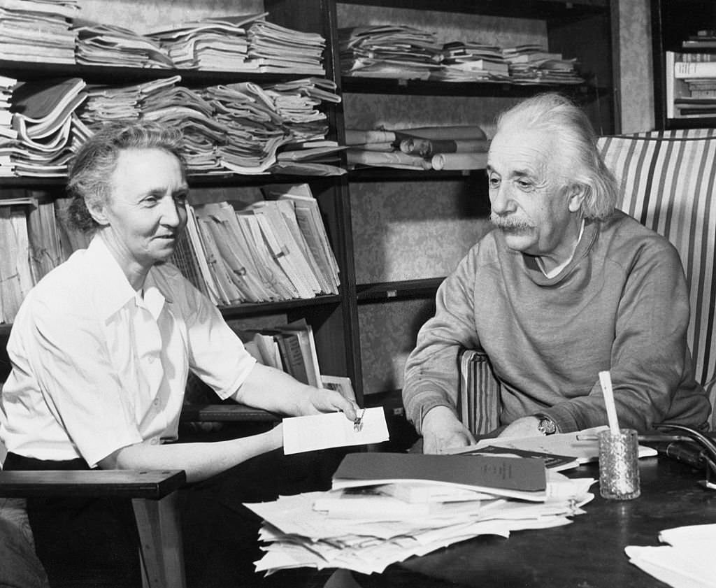 Albert Einstein (right) and Madame Irene Joliot Curie, French nuclear physicist, talk informally in the study of Einstein's home in Princeton, N.J.