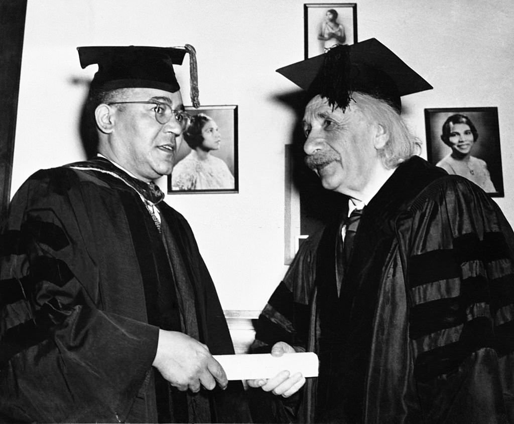 Einstein receives honorary degree from Horace Mann Bond, President of Lincoln University. The photo on wall is singer Marian Anderson.