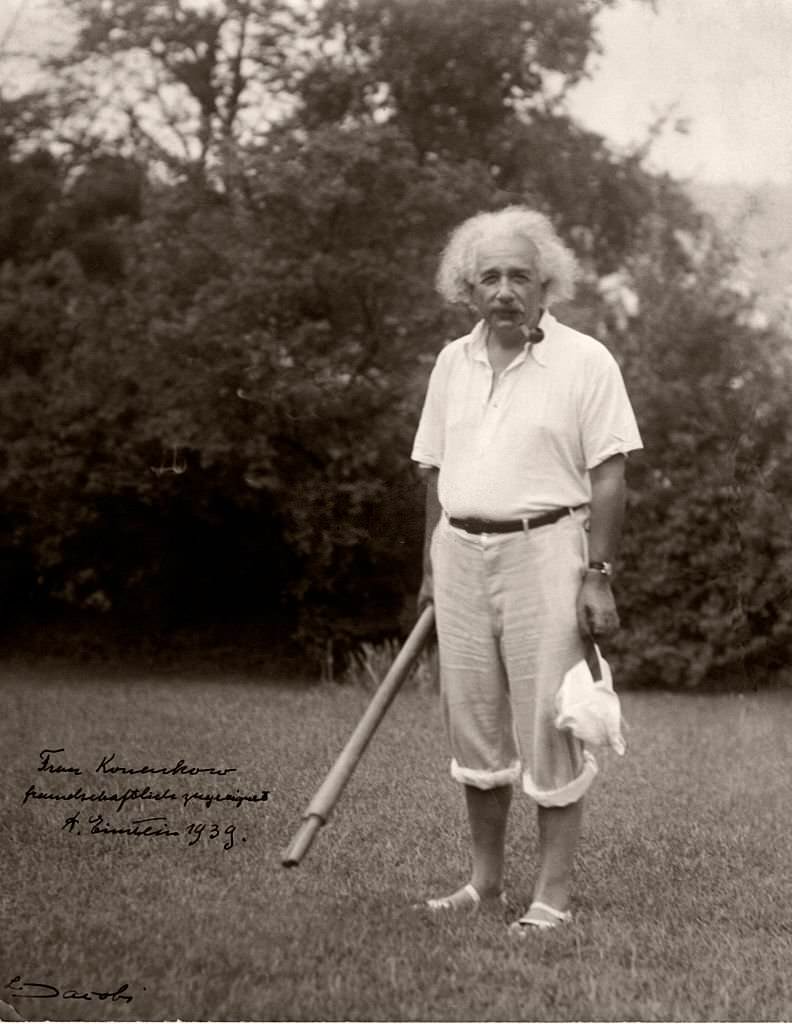 Albert Einstein smoking a pipe.