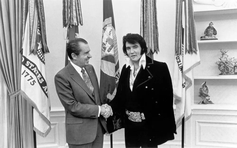 Richard Nixon greets Elvis Presley at the White House, 1970.