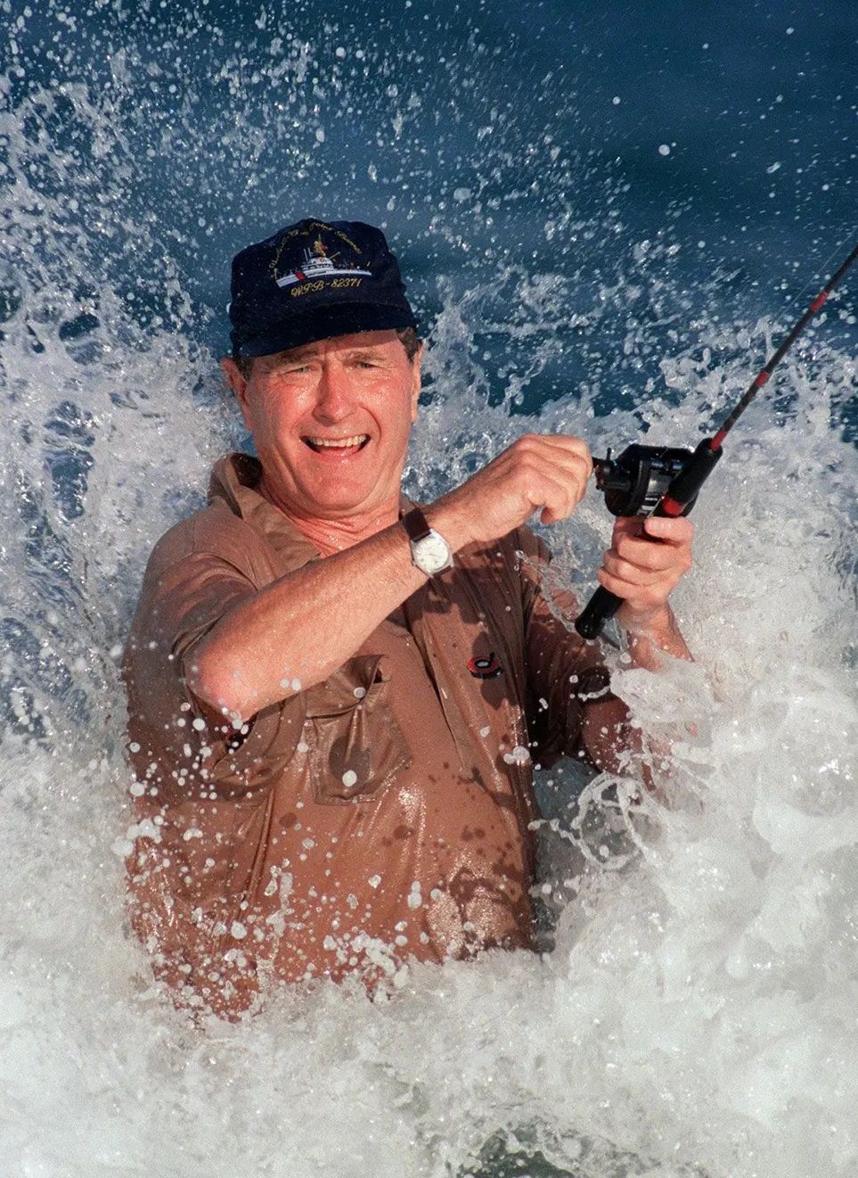 George H.W. Bush fishes in the surf in Florida, 1988.