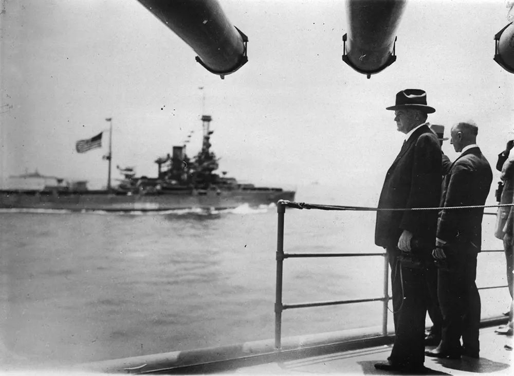 Herbert Hoover stands on board the cruiser USS Salt Lake City, 1931.