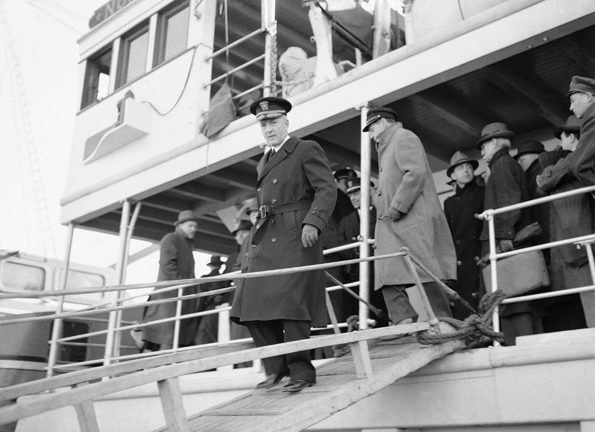 Admiral Richard E. Byrd, leaving the North Star in Boston, the Snow Cruiser in background.