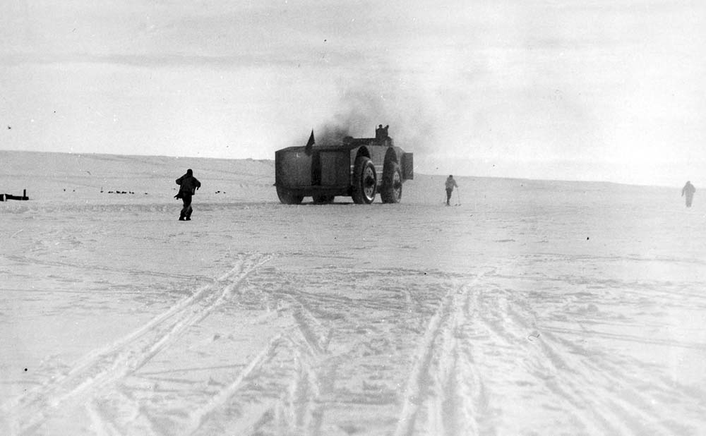 The Snow Cruiser drives away from the North Star after unloading.