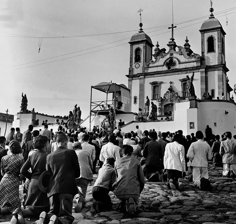 Worshippers approach Bom Jesus do Matozinhos Church on their knees.