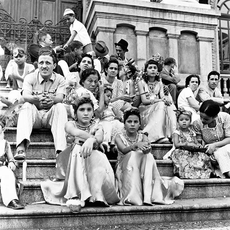 Carnival participants wait to join a parade.