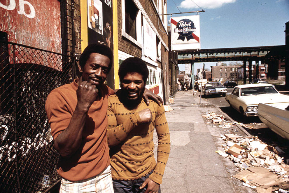 Men pose on a South Side street, May 1974.