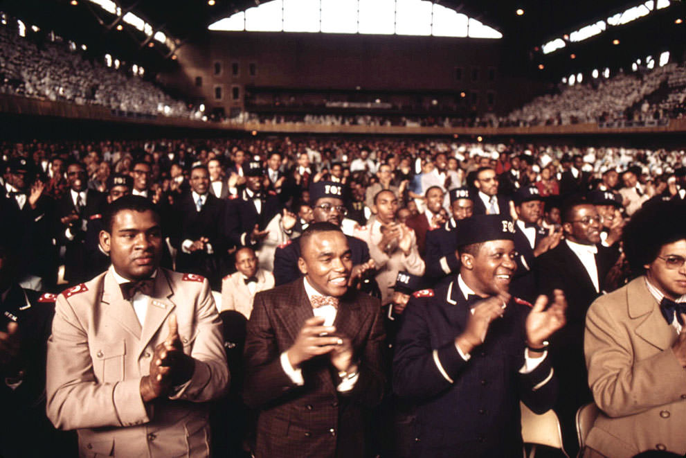 A portion of a crowd of some 10,000 Muslims applauds Elijah Muhammad during the delivery of his Savior’s Day Message in Chicago, in March 1974.