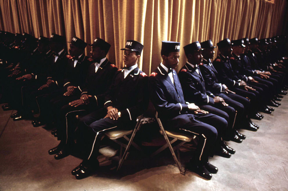 “The Fruit Of Islam”, a special group of bodyguards for Muslim Leader Elijah Muhammad, at the base of the platform while Muhammad delivers his annual Savior’s Day Message in Chicago, March 1974.