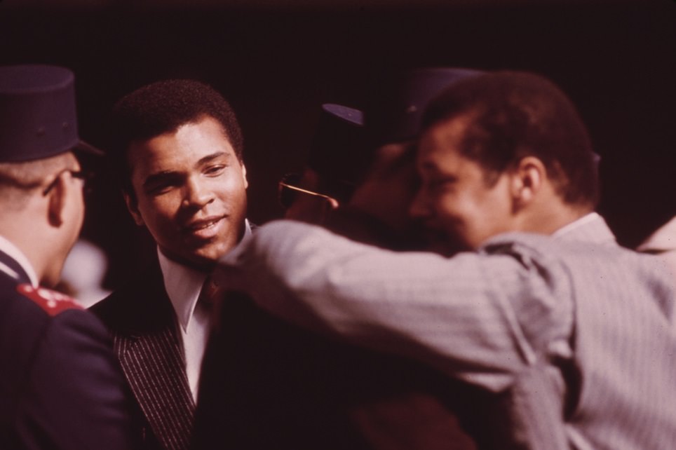 World heavyweight boxing champion Muhammad Ali, a black Muslim, attends the sect’s service to hear Elijah Muhammad deliver the annual savior’s day message in Chicago.