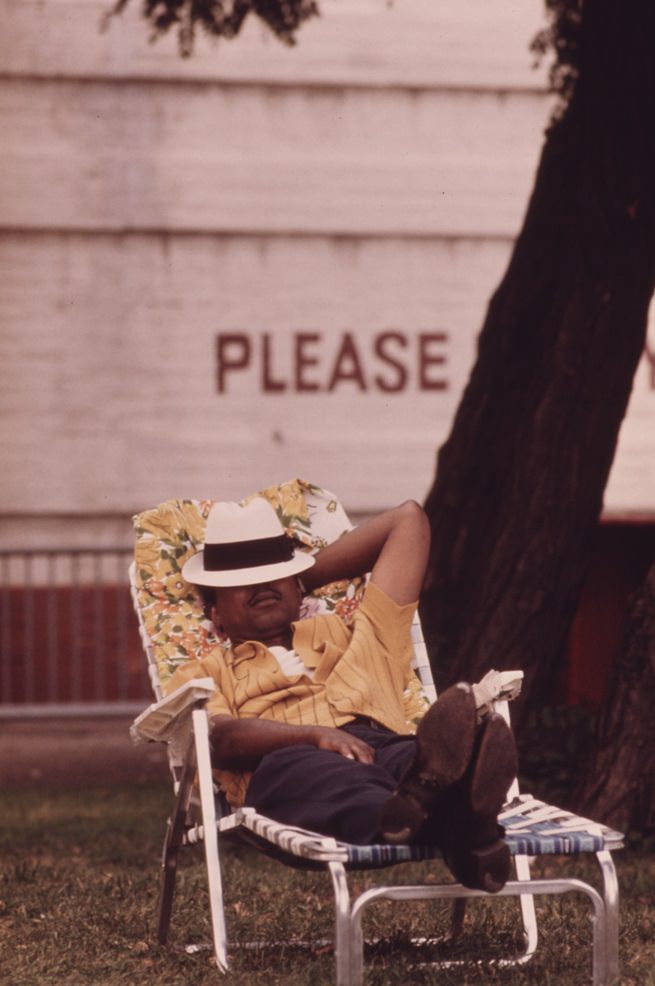 A man enjoying a nap on a chaise lounge in Chicago’s South Side.