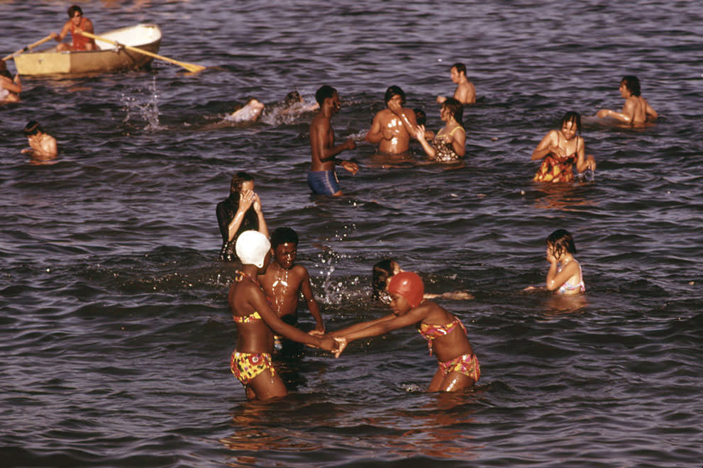 Swimmers take to the water at 12th Street Beach on Lake Michigan, in August of 1973.