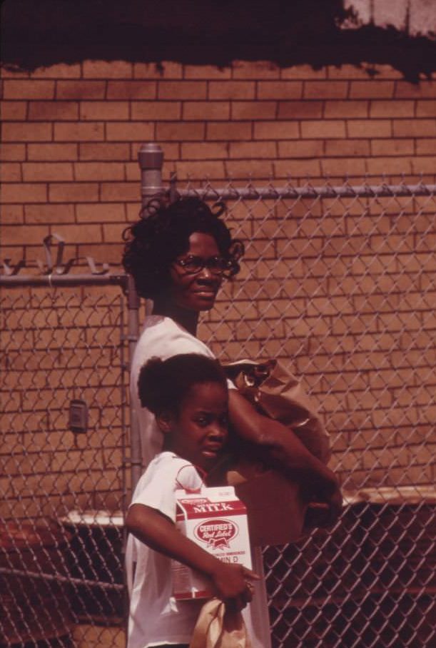 Mother and daughter returning home after a grocery shopping expedition in Chicago’s West Side.