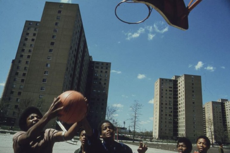 Black youths play basketball at Stateway Gardens’ Highrise Housing Project on Chicago’s South Side.
