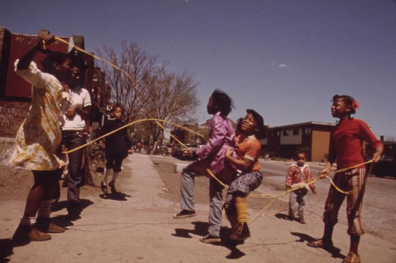 Children play outside the Ida B. Wells Homes, one of Chicago’s oldest housing projects. There are 1,652 apartments housing 5,920 persons in 124 buildings on the South Side.