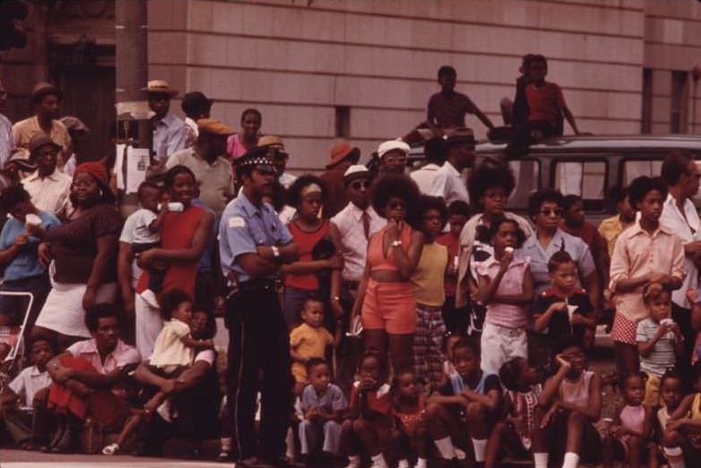 Members of Chicago’s South Side Black community line a portion of Dr. Martin L. King Jr. Drive to watch the Annual Bud Billiken Day Parade.