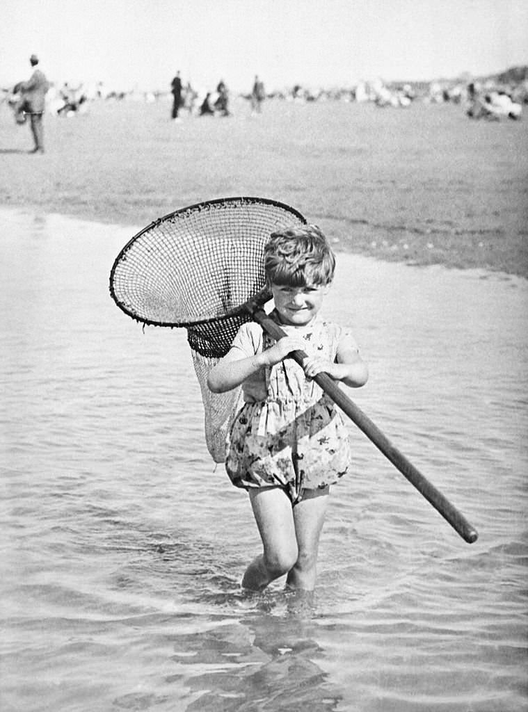 Young girl on the beach of Deauville in 1927 in Deauville, France.