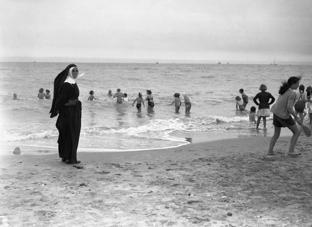 Nun on the beach of Deauville, 1950