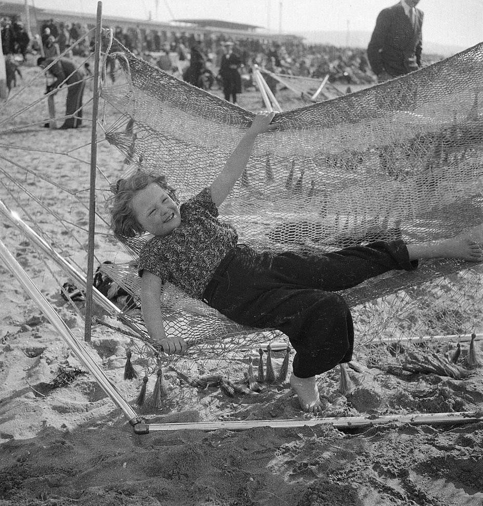 Little girl in a hammock, Deauville, 1937.