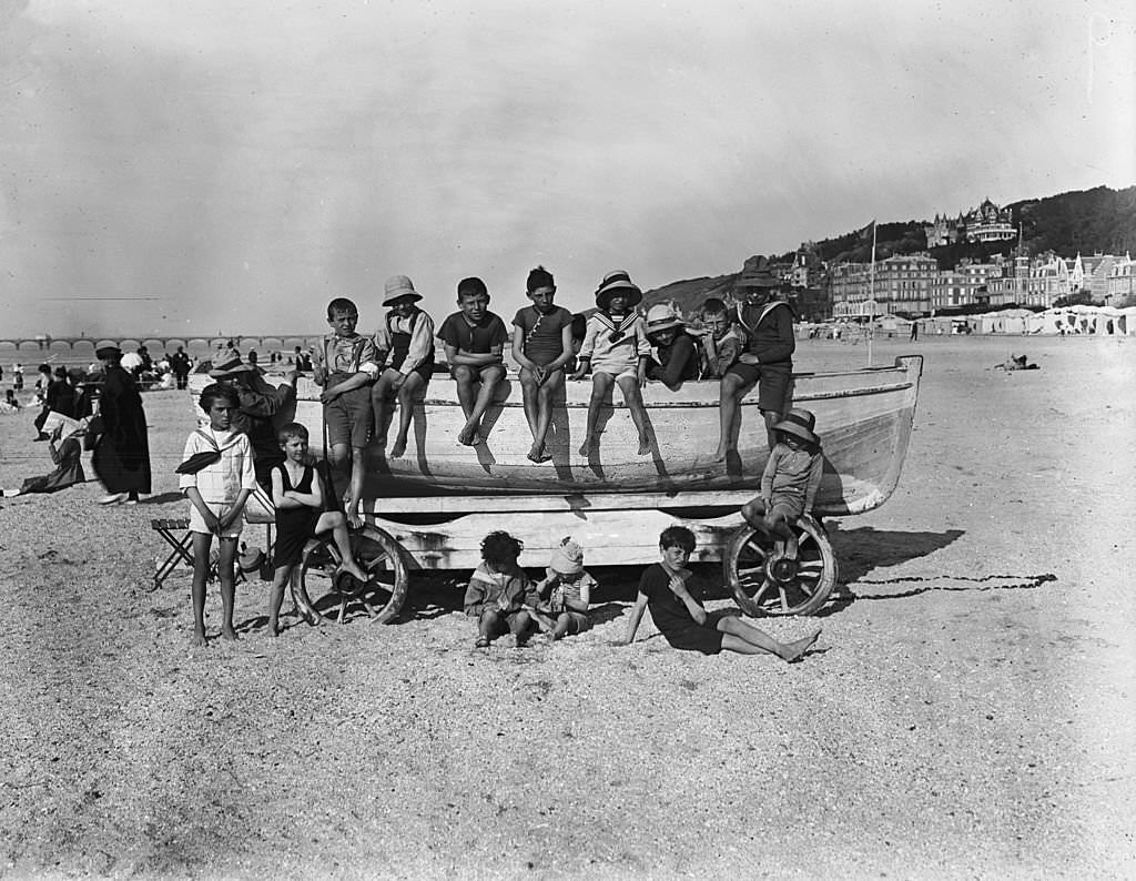 Youngsters relax on the sands at Deauville, 1919