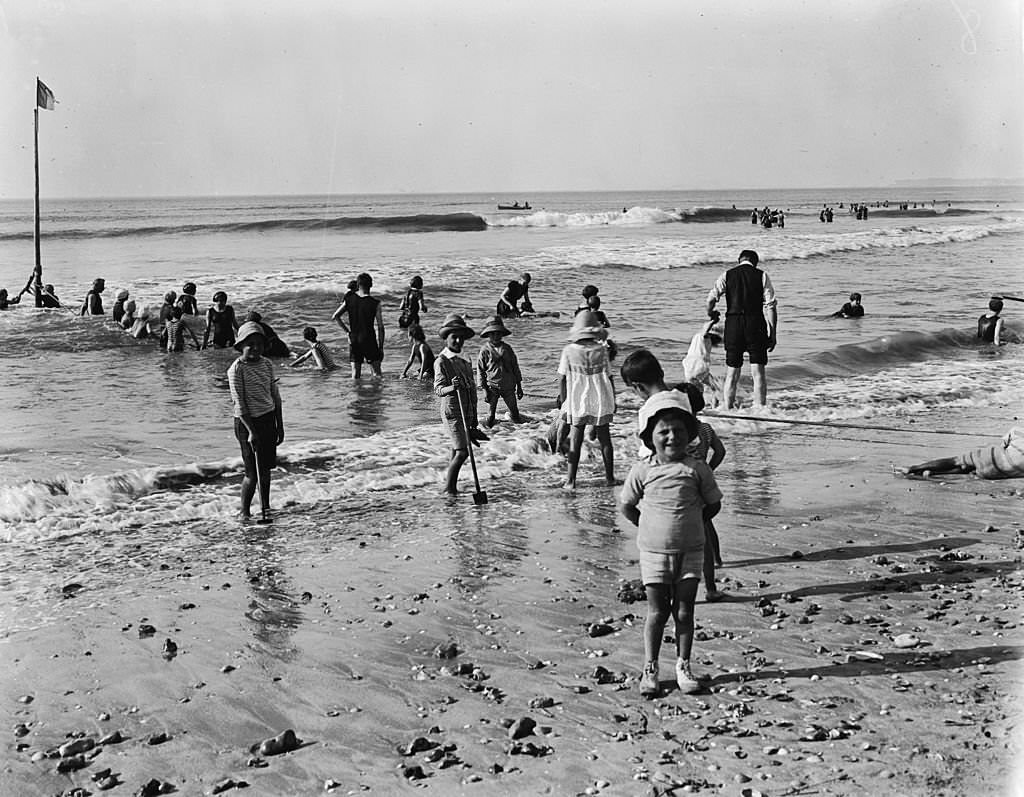 Children at play on the sands at Deauville, 1919