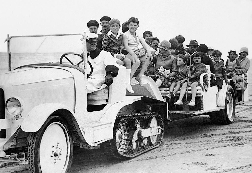 Families in tracked Vehicles on Deauville Beach, 1925.
