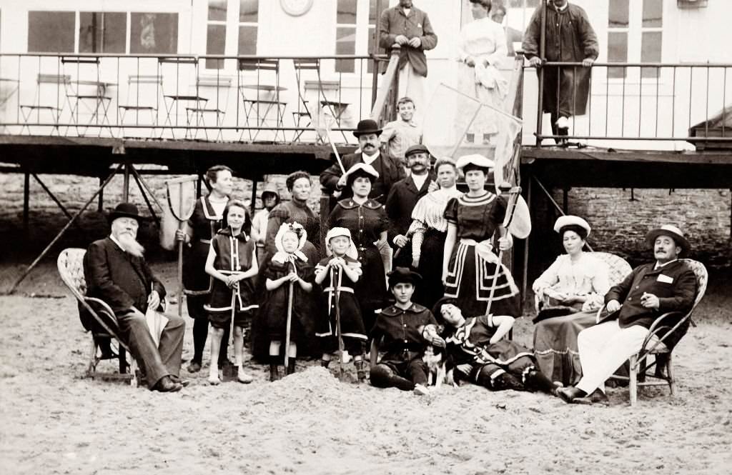 A family group on a holiday outing to a beach at Deauville, 1910
