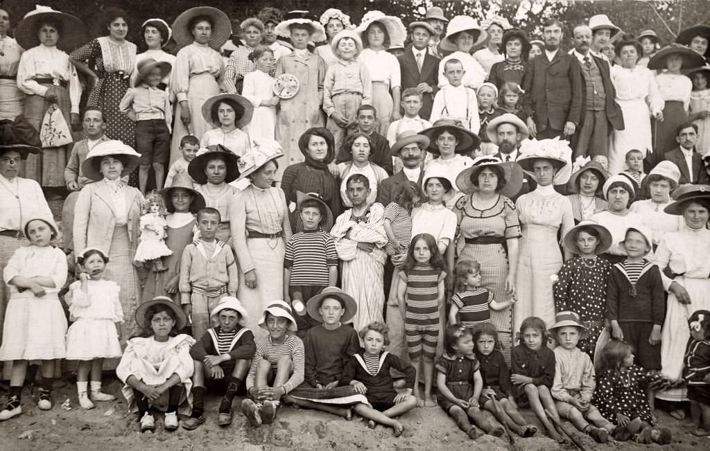 A large group of people on a holiday outing at the beach at Deauville, 1910