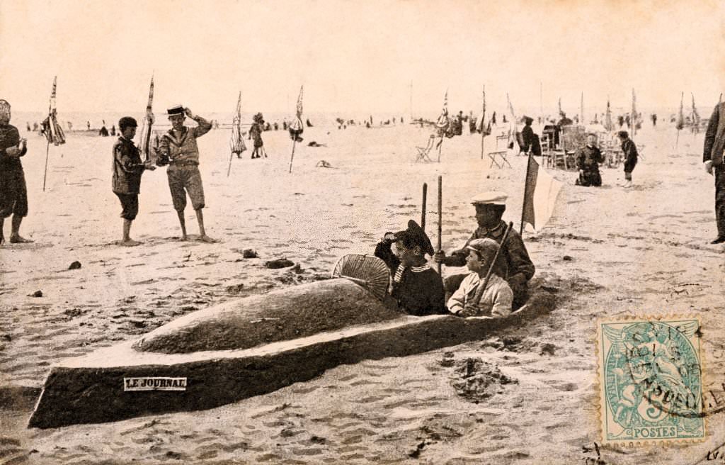 The many pleasures available on a beach, including building a sand boat, at Deauville, 1909