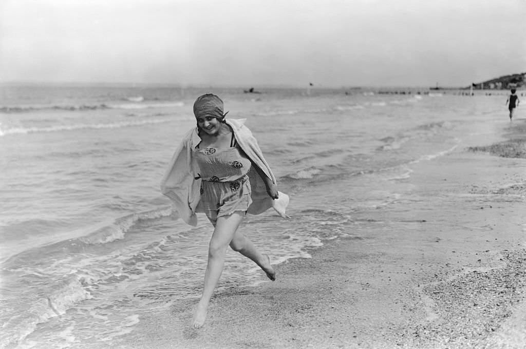 A Young Woman Runs Along the Shore at Deauville, 1924