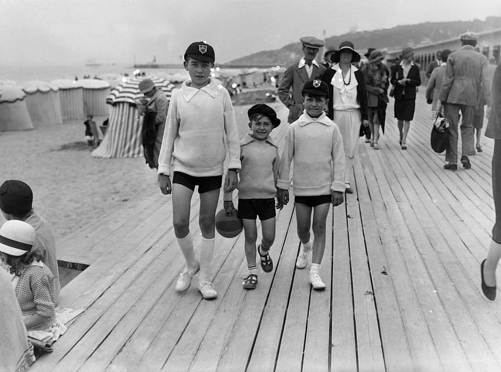 Children strolling on the famous Planches in August 1929 in Deauville, France.