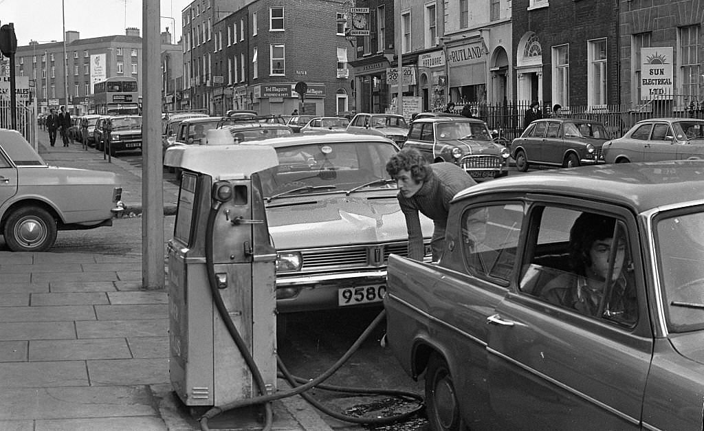 Street scene, people queuing for petrol, Dublin, 1975